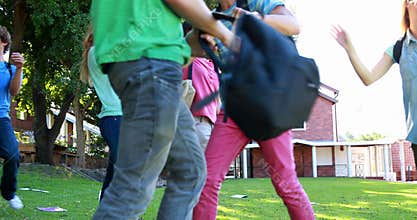 Celebrating students running and jumping together