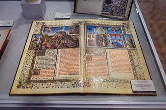 Chiclana, Spain 26 Sep 23: Illuminated medieval manuscript open in museum display case