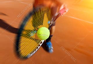Male tennis player in action
