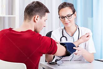 Doctor measuring blood pressure