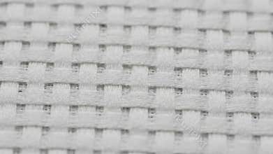Extreme Close Up of a Woven White Industrial Filter Material with a Simple Grid Pattern Perfect for Backgrounds or Textures as