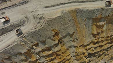 Aerial of open mine and heavy mining equipment