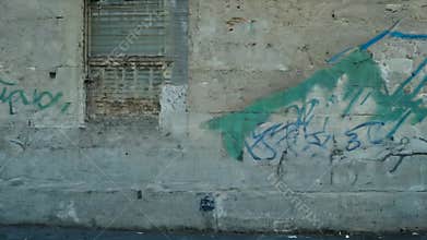 Green and Blue Graffiti on an Old Concrete Wall in Europe
