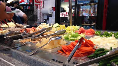Customers choosing food for their meal