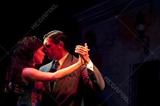 Tango Dancers at Night in Street of Buenos Aires, Argentina. Street Life, Couple Dancing Close Together, Head on Head.