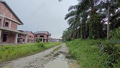 stagnant pool of rainwater along the diminishing perspective rural pathway into the rural countryside