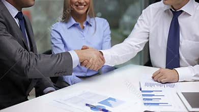 Two businessmen shaking their hands