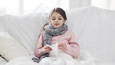Ill girl with paper tissue