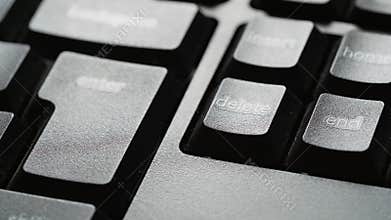 Fingers pressing on delete option from pc.