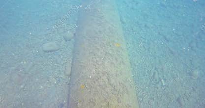 Top view of an oil pipeline underwater at great depth.