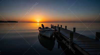 Boat on Calm Water at Sunset