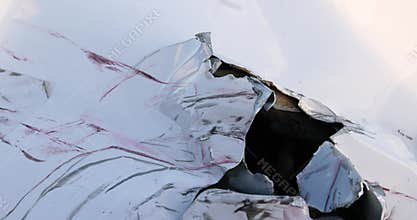 a metal part of a car damaged during a road accident