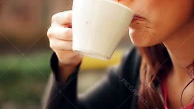 Woman drinking coffee