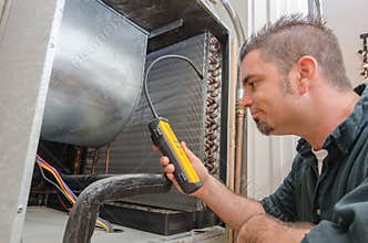 HVAC Technician with Leak Detector