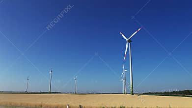 Wind turbine on the blue sky green energy footage