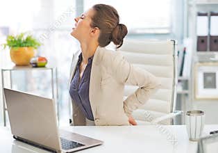 Portrait of business woman with back pain