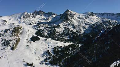 Aerial view of the snowed alpine mountain ranges in Ordino, into the small Pyrenean country of Andorra.