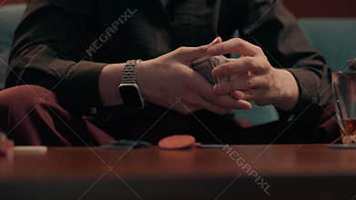 Caucasian male gambler shuffling cards smoking cigar drinking whiskey at home unknown unrecognizable guy man poker