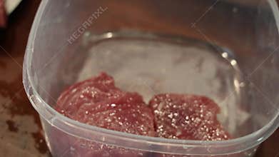 Mom and daughters cook marinated tuna