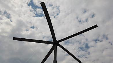Abstract starburst against cloudy sky
