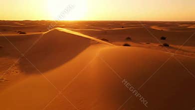 Sweeping cinematic view over vast, untouched sand dunes, evoking feelings of solitude, expansiveness, and majestic wilderness.