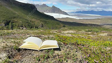 Open Sketchbook on Rock in Expansive Icelandic Highland Landscape