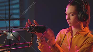 Young woman getting ready for her live broadcasting