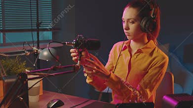 Young woman getting ready for her live broadcasting