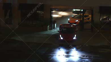 Sports Cars Drive Out Tight Shot