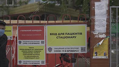 Announcements and warnings at the entrance to the hospital. Hospital entrance corridor. Official centre or headquarters