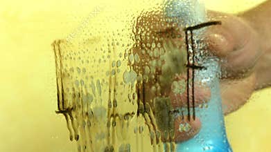 Erasing belief concept. Close up hand cleaning mirror wiping out belief word