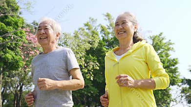 Elderly asian couple exercising outdoors