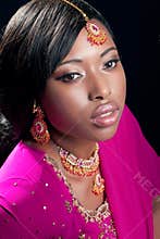 Young woman wearing indian clothes and jewelry