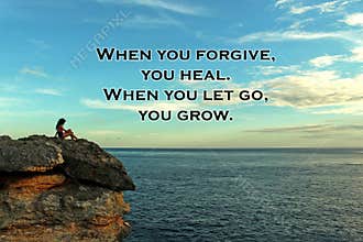 Inspirational quote - When you forgive, you heal. When you let go, you grow. On blurry background of bright blue sky over horizon.