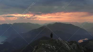 Hiker climbing Schafberg mountain at sunrise in Austria