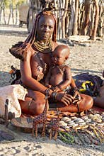 Himba mom with her baby in her arms. Namibia