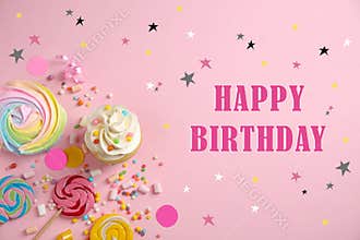 Flat lay composition with delicious cupcake and text Happy Birthday on background