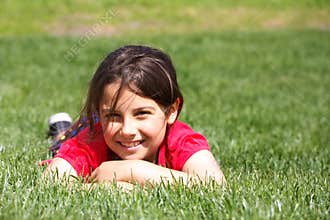 Smiling girl in grass