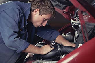 Mechanic fixing auto in car service