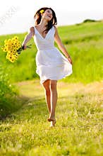 Adorable happy summer woman skipping