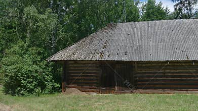Old rustic log barn in countryside