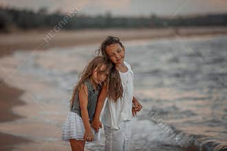Two sisters  on the shore of the sea