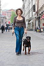 The woman walking with a dog