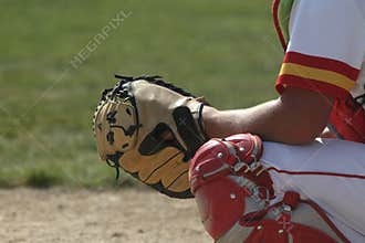 Baseball Catcher Crouches Behind the Plate
