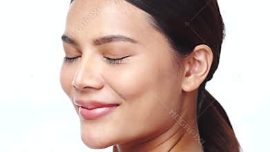 Closeup face of beautiful Asian woman looking at the camera over white background