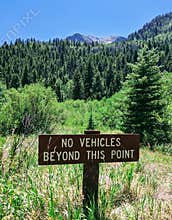 No vehicles beyond this point. Sign marking the end of the road.