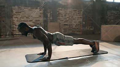 Exercise. Sport man working out in gym, doing push-up