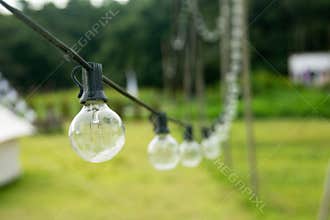 Outdoor string Light bulbs hanging on a line