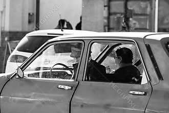 Driving old Dacia 1300 close up isolated. Couple in Dacia 1300 romanian vintage car on the streets of Lugoj, Romania, 2020