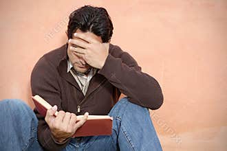 Man reading book or bible